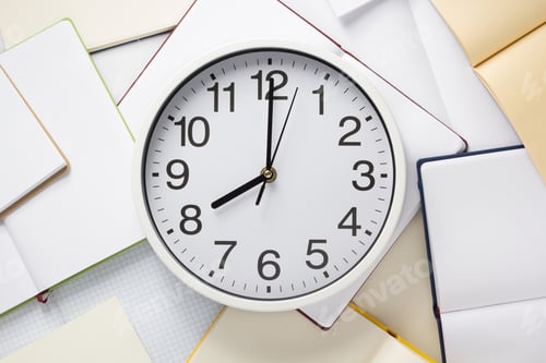 Preview: wall clock and open notebook or book