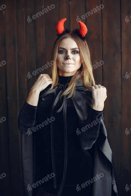 Preview: Portrait of smiling woman with Halloween skull make up