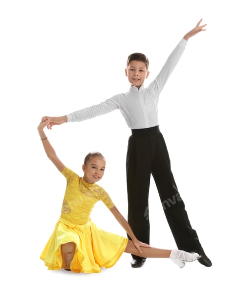 Preview: Beautifully dressed couple of kids dancing on white background