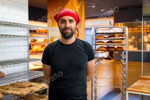 Preview: Corporate portrait of bakery manager in workshop of artisan bakery