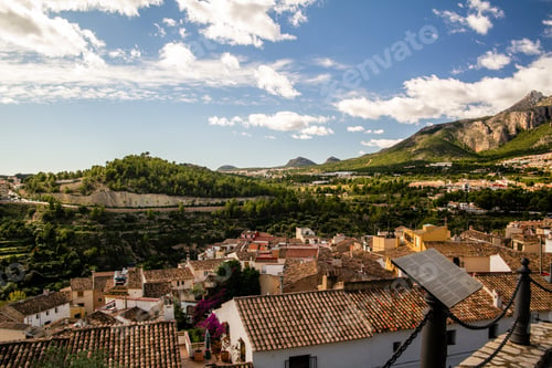 Preview: Beautiful shot of the buildings and nature of Polop city in Spain with mountains in the background