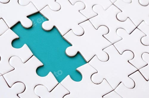 Preview: Close-up texture of a white jigsaw puzzle in assembled state with missing elements