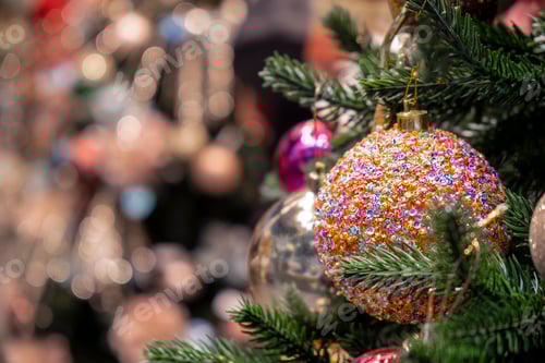 Preview: Colorful ball on Christmas tree with bokeh lights on background.