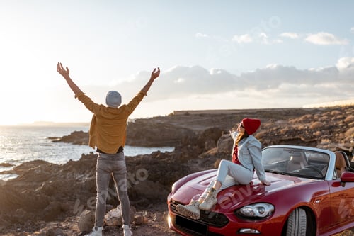 Preview: Lovely couple traveling by car near the ocean