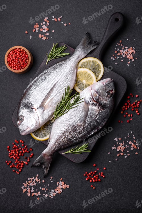 Preview: Fresh raw dorado fish with spices, herbs, salt and lemon
