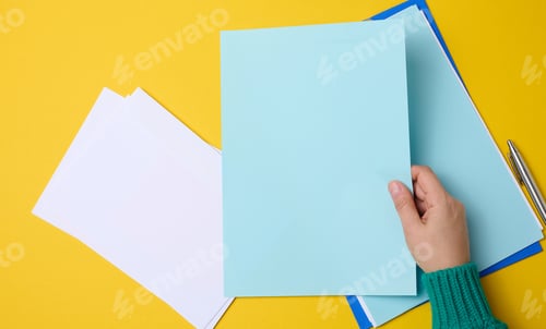 Preview: Blank blue sheets and female hand top view. Text writing, list