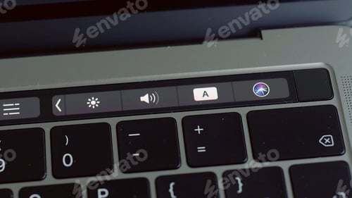 Preview: Close up of a finger unblocking modern laptop with touch id technology. Action. Using male