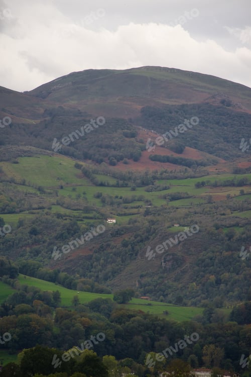 Preview: Autumn landscape with colorful mountains and trees.