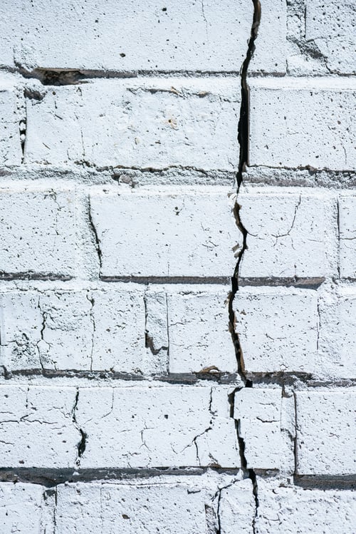 Preview: close-up view of old white cracked brick wall background