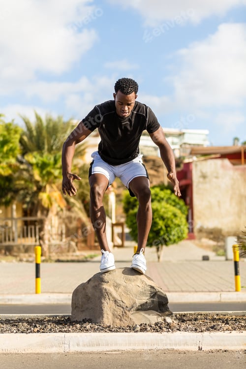 Preview: Black african american young man streching after outdoor jogging