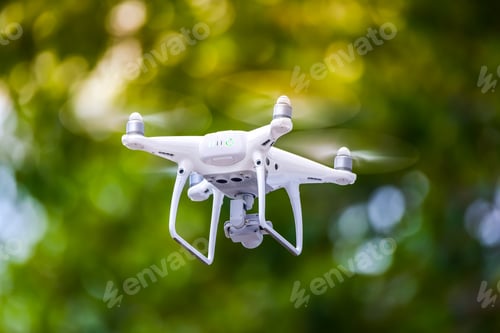 Preview: Drone is flying with digital camera to take photo and video on ground floor..