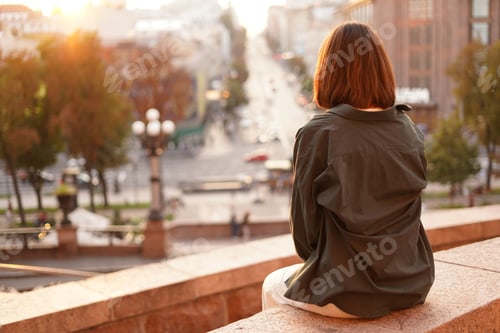 Preview: Woman at sunset with amazing city view, enjoying warm days, freedom, positive vibes