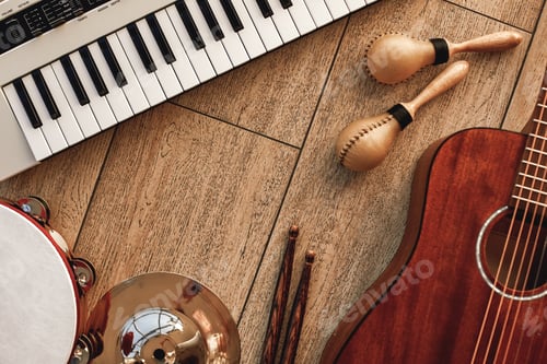 Preview: Creating a melody...Top view of musical instruments set: synthesizer, electronic guitar, wooden drum