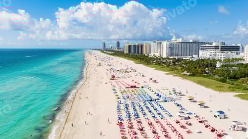 Preview: Drone aerial view at Miami South Beach Florida, Beach with colorful chairs and umbrellas