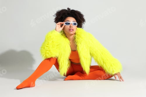 Preview: Fashionable portrait of beautiful Brazilian woman in stylish outfit on white background