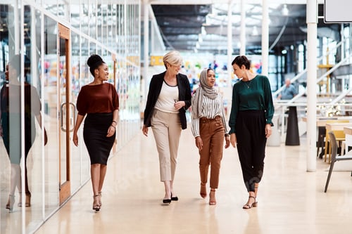 Preview: Shot of a group of businesswomen walking alongside each other in an office