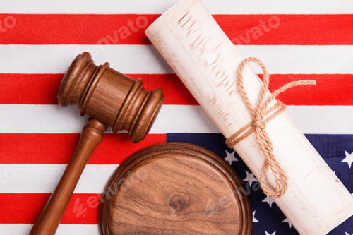 Preview: Flat lay judge gavel and the usa flag.