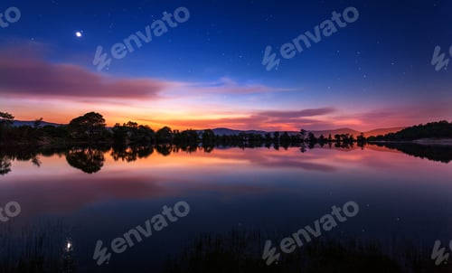 Preview: Beautiful spring night on the pond with stars, clouds and refle