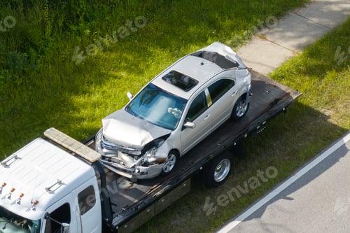 Preview: Traffic accident with tow truck hauling smashed vehicle