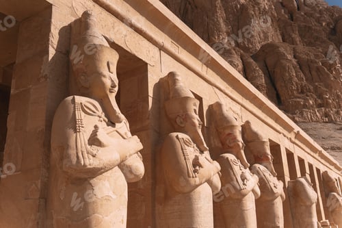 Preview: Majestic statues of pharaohs guarding hatshepsut temple in luxor, egypt
