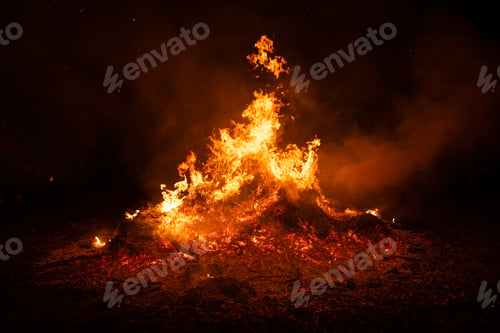 Preview: Big pile burning in the middle of the field