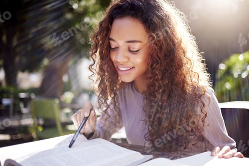 Preview: I know this section pretty well. Shot of a young female student studying at a cafe.