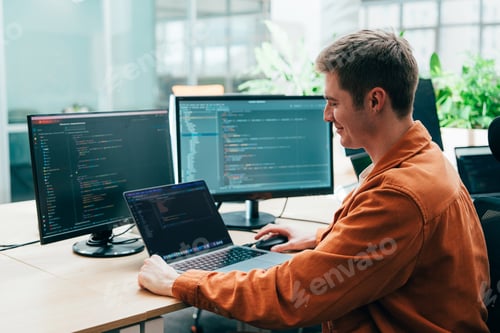 Preview: young programmers working on a new project for a start up business.