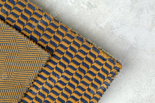 Preview: The background consists of several types of old colored tiles with different patterns on mustard