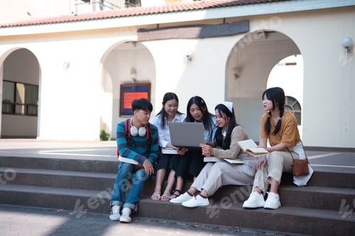 Preview: Group of students studying on campus outdoors