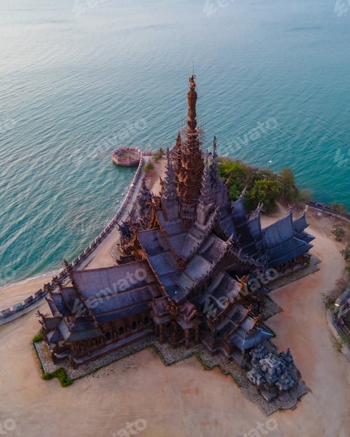 Preview: Sanctuary of Truth, Pattaya, Thailand, wooden temple by the ocean at sunset on the beach of Pattaya
