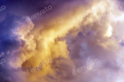 Preview: Dramatic clouds painted in shades of gold and purple
