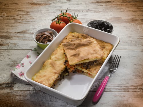Preview: focaccia stuffed with black olives tomatoes and anchovies