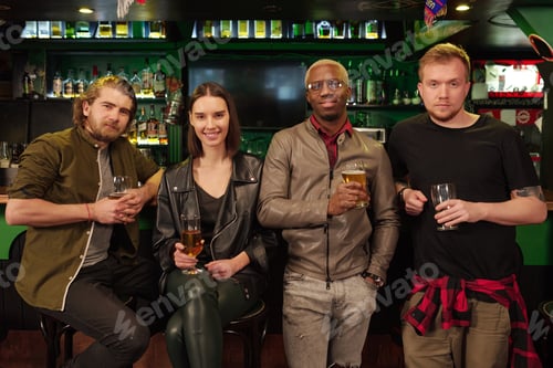 Preview: Friends drinking beer in pub