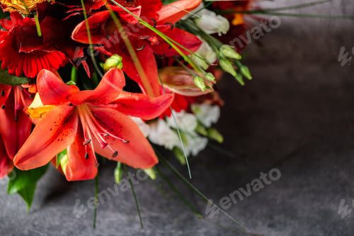 Preview: Vibrant Bouquet of orange Asiatic lilies and other flowers