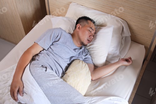 Preview: Asian man sleeping and snoring loudly