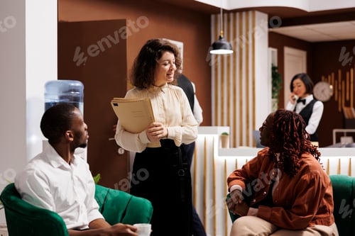 Preview: Hotel manager talking to guests