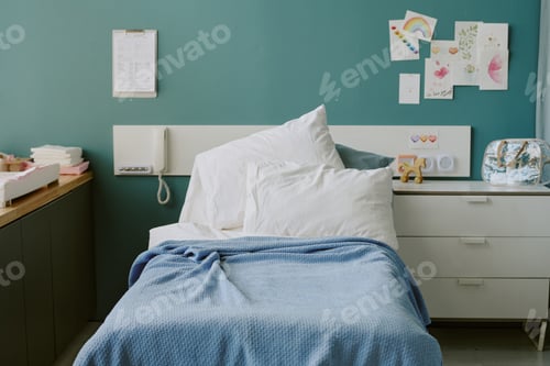 Preview: Cozy Hospital Room with Bed and Colorful Wall Decor