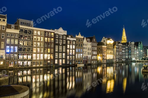 Preview: Beautiful shot of illuminated buildings along the canal in Amsterdam, Netherlands