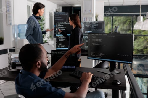 Preview: African american web developer in wheelchair looking at programming languag