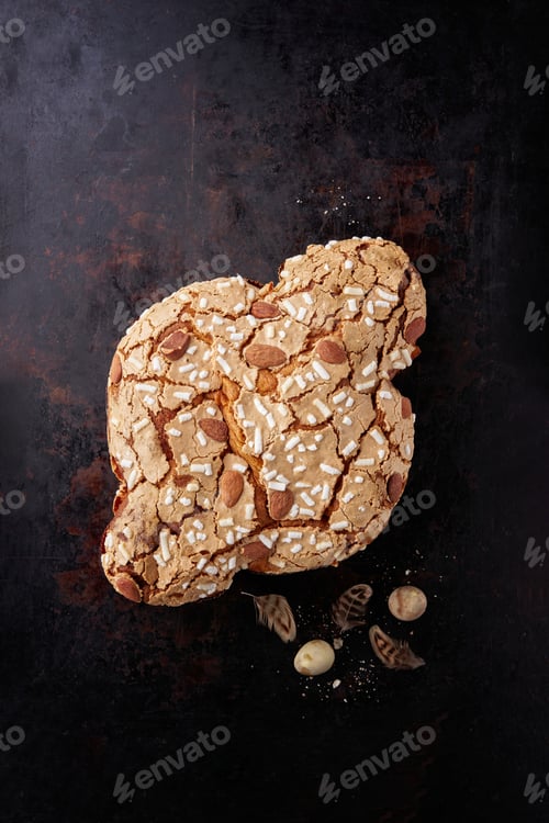 Preview: Colomba Pasquale, Italian Easter Dove Sweet Bread Colomba di Pasqua on dark surface.