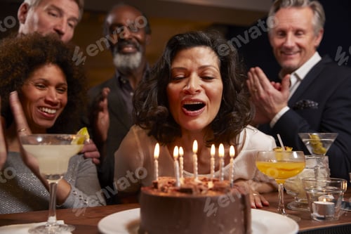 Preview: Group Of Middle Aged Friends Celebrating Birthday In Bar