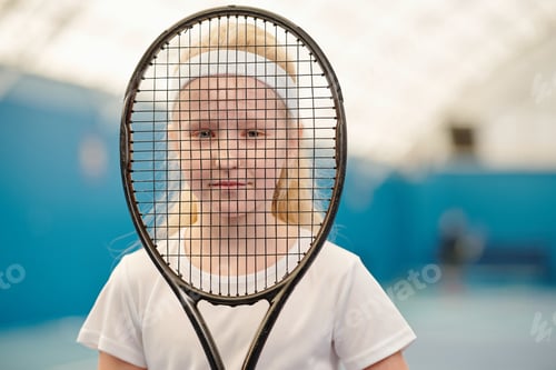 Preview: Girl in white t-shirt and headband holding tennis racket in front of her face