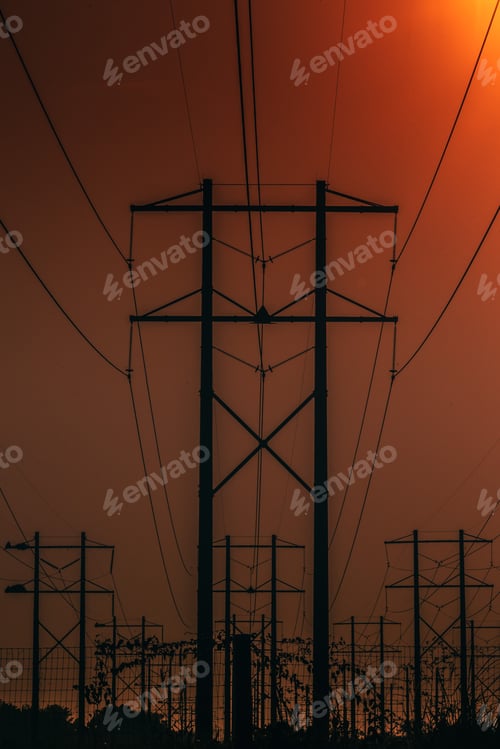 Preview: Vertical shot of a transmission tower during sunset