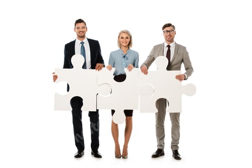 Preview: businesspeople holding puzzle elements isolated on white, teamwork concept