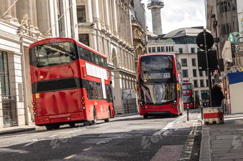 Preview: Red double decker buses driving on london street