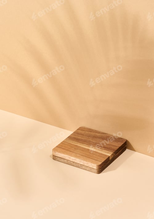 Preview: Wooden platform, shadow from a palm leaf on a brown background. Place for displaying cosmetics