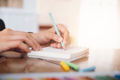 Preview: Female hand writing notebook.