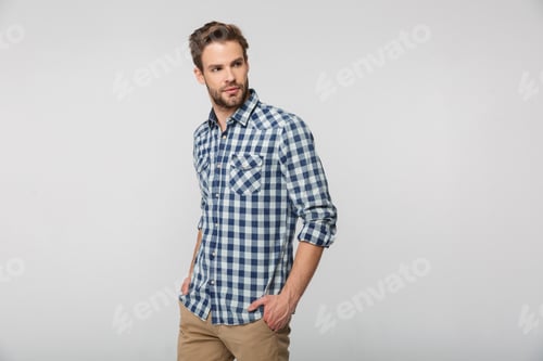 Preview: Man Poses Wearing a Plaid Shirt and Pants