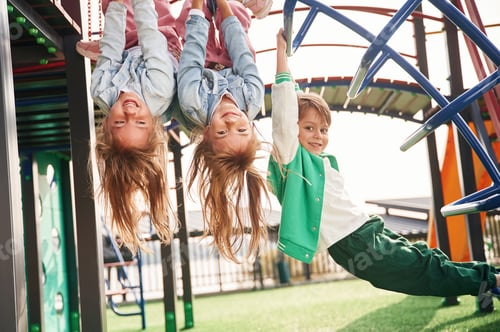 Preview: Beautiful sunlight. Kids are having fun on the playground
