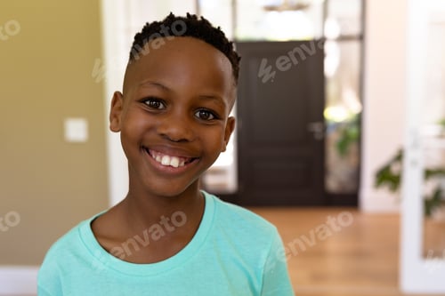Preview: Portrait of a mixed race boy enjoying his time at home
